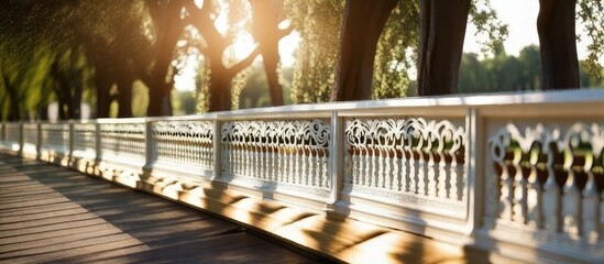 Park Elegance A scenic landscape featuring a white balustrade bathed in the warm hues of the setting sun - obrazy, fototapety, plakaty
