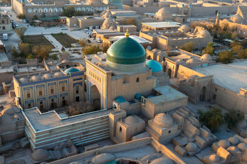 Historical buildings of Khiva Uzbekistan from above. Building with green dome is mausoleum of...