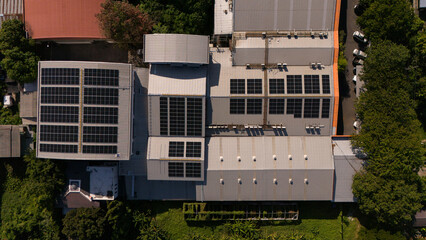 Aerial view from a solar panel drone outside a building. Installing solar cells on the roof Solar...