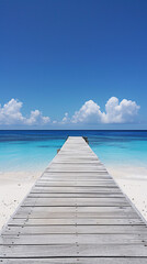 Obraz premium A beautiful wooden walkway or pier leading into a clear blue ocean on a sunny day, perfect summer vacation, travel inspiration