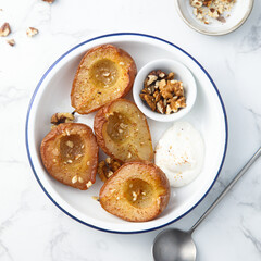Roasted pears with walnut and yogurt