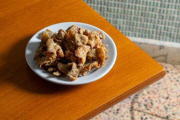 Delicious Rissol pork cracklings, a traditional Alentejo appetizer, crispy and golden, perfect to captivate lovers of Portuguese gastronomy. Authentic flavor in every bite!