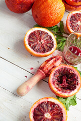 Sliced Blood Oranges with Juicer and Fresh Mint - 713080866