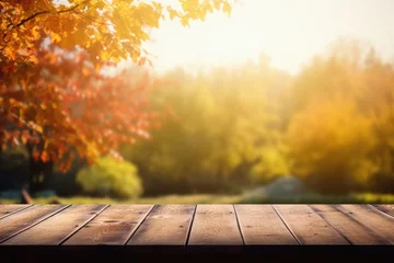 Gordijnen Empty blank wooden table fall background with autumn trees orange yellow color leaves backdrop forest or park nature scene abstract blurred bokeh tabletop for product display desk mockup. Copy space. © Synthetica