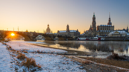 The historical waterfront of Elbe river with the Dresden Cathedral (Hofkirche) early morning with...