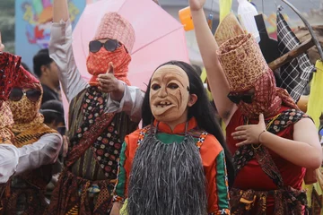 Papier Peint photo Carnaval sekura mask dancers at the Krakatau festival in Lampung