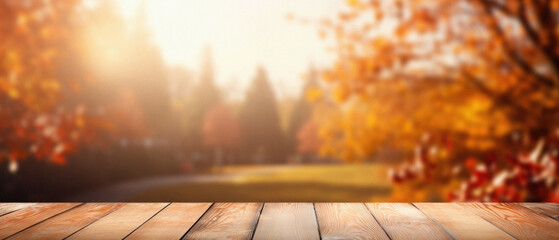 Empty blank wooden table fall background with autumn trees orange yellow color leaves backdrop forest or park nature scene abstract blurred bokeh tabletop for product display desk mockup. Copy space.