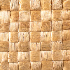 Intricate reed straw weave background texture in stunning close-up