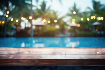 Obraz na płótnie Canvas Wooden table pool bokeh background, empty wood desk product display mockup with blurry tropical hotel resort abstract poolside summer travel backdrop advertising presentation. Mock up, copy space.