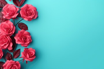 Pink roses on blue background. Flat lay, top view