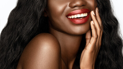 Red lips make up. Cropped portrait Beautiful African American model with a glowing skin and long wavy hair is smiling. - obrazy, fototapety, plakaty