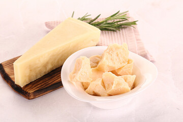 Chopped Italian hard parmesan cheese