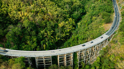 Aerial view of bridge over highway road in  green of National park