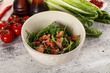 Salad with salmon and arugula