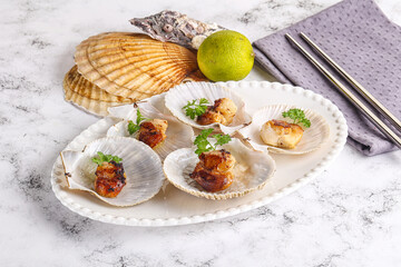 Grilled scallops shell with butter