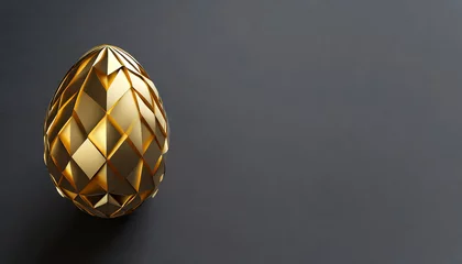 Fototapeten Golden Easter egg on dark background with copy space © Ester