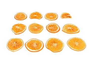 sliced dried oranges on a white isolated background close up