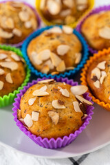 Lemon poppy seed muffins garnished with almond slivers