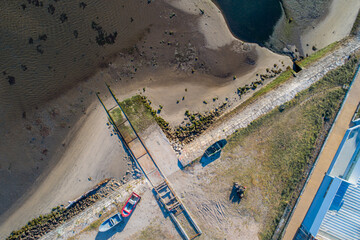 zenithal aerial view with drone of fishing boats on land off the coast