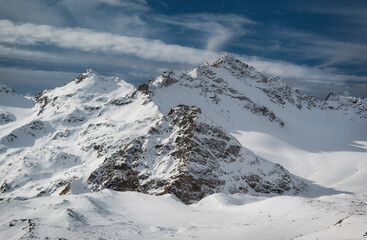 Fototapeta na wymiar Snow covered mountains, Elbrus ski resort. The part of caucasisan mountains range.