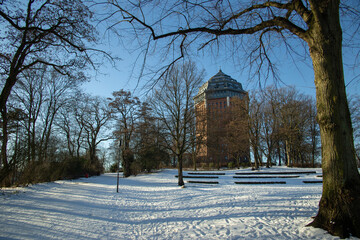 Hamburg in winter, Park around an ancient water tower in Sunny frosty day. High quality photo