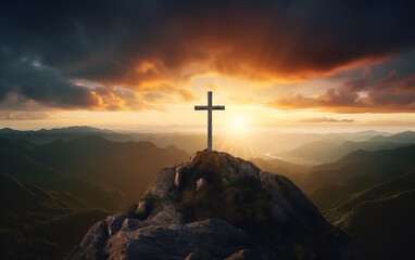 Cross on top of mountain with sunset sky background. Christian symbol.