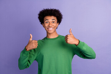 Photo of attractive confident man dressed green sweater showing two thumbs up isolated violet color background