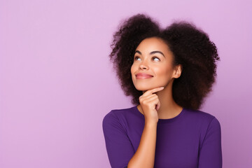 Cute African American lady thinking about her inspiration touch chin looking mockup choosing product option isolated on purple color background - obrazy, fototapety, plakaty