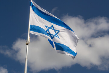 Israeli flag for advertising, celebration, achievements, festivals, elections. The flag of Uzbekistan flutters in the beautiful sky. Great for news...