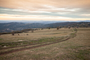 Fototapeta premium Panorama of the top and summit of Vrh Rajac moutain at dusk in autumn. Rajac is a mountain of Sumadija in Serbia, part of the dinaric alps, a major serbian natural touristic destination.