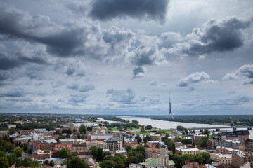 Obraz premium Aerial Panorama of Riga with the daugava river during a sunny afternoon, with the radio and tv tower in background. Riga is the capital city of Latvia, in the baltic countries.