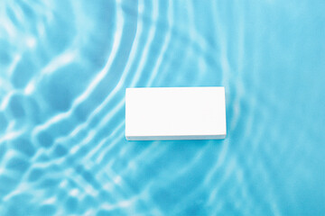 blue wave abstract or rippled water texture background. white podium for products display