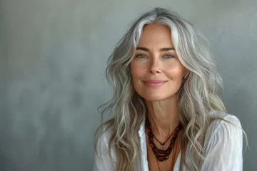 Fotobehang Smiling sophisticated 50s middle aged grey haired business woman looking at camera. Happy mature elegant old lady professional businesswoman © Tjeerd