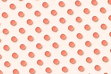 Cosmetic pattern jar with cream cosmetic product on a beige background