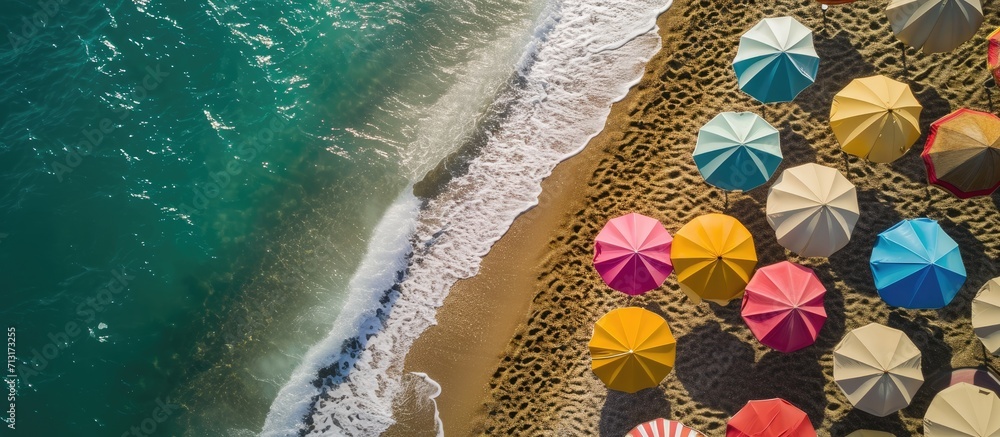 Poster tropical beach with colorful umbrellas picture with drone. copy space image. place for adding text