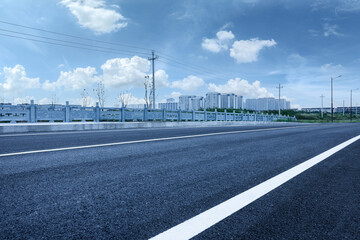 Fototapeta na wymiar New asphalt roads and construction landscaping