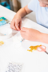 Obraz na płótnie Canvas Colorful Clay Beads Set for Creative Kids' Bracelet Making