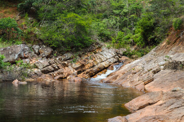 Naklejka na ściany i meble Delicate waterfall in the region called Serra do Gandarela in Minas Gerais, Brazil