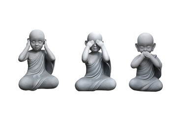 A group of three small wise monk statues  isolated on white (see no evil, hear no evil, speak no...