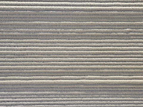 Closed up of the 3d printing in concrete material in horizontal line