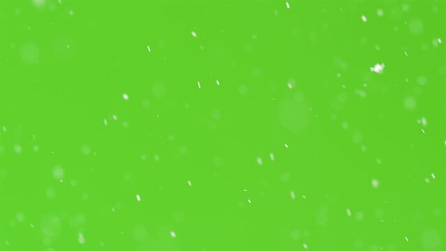 It is snowing in green screen background, snow video overlay