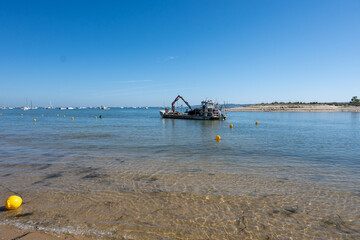 View on Arcachon Bay with many fisherman's boats and oysters farms near Le Phare du Cap Ferret, Cap...