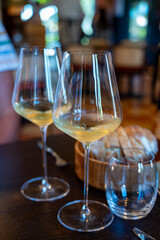 Tasting of Bordeaux white wine in Sauternes, left bank of Gironde Estuary, France. Glasses of white sweet French wine.