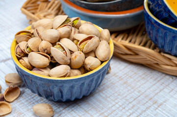 Roasted salty pistachio nuts, tasty healthy vegetarian snack food