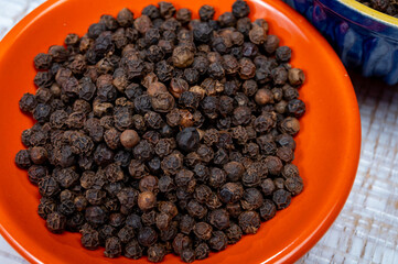 Indian spices collection, dried black peppercorns, kitchen spices