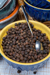 Indian spices collection, dried black peppercorns, kitchen spices