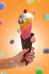 Woman's hand holding vanilla jelly ice cream cone. Ice cream cone in hand.