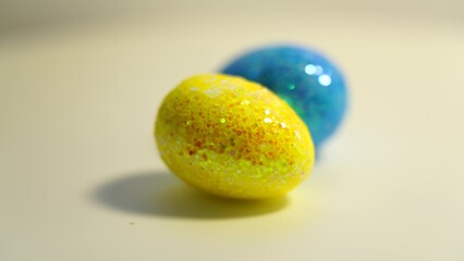 Colorful Easter eggs rotating in rows in a seamless loop on a light background
