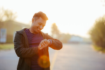 Portrait of a young Asian man in sports clothes jogging in the morning. man running at sunrise health care