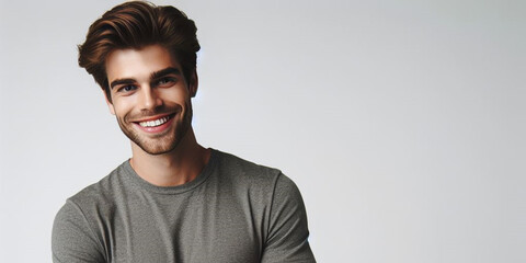 Obraz premium studio photograph of a happy young man posing at white studio background